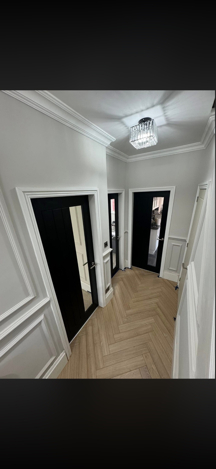 Black glazed internal doors and herringbone flooring